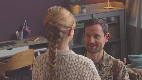 Military Man Embracing Woman in Loving Reunion
