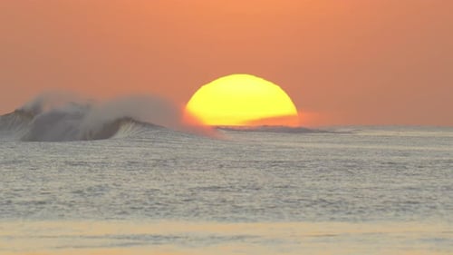 Golden Sunset Over Ocean Waves Rolling In