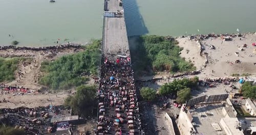 Bridge Over River with Crowds of People