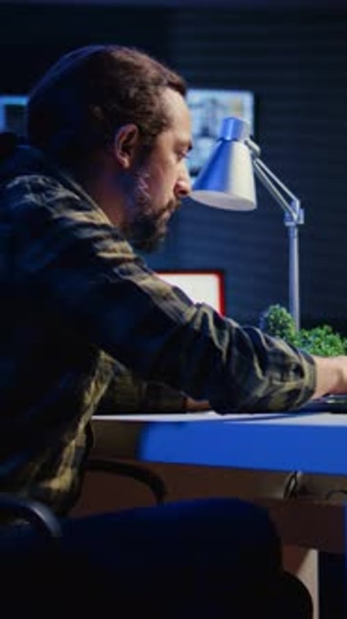 Vertical Video Man Concerned About Statistical Data Financial Graphs on Laptop Screen