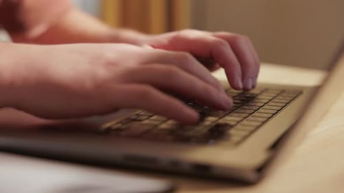 Close Up Of Hands Typing On Laptop Computer