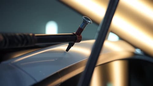 Process of Pointless Dent Repair on Car Body Mechanic at the Auto Shop with Tools to Repair Dents in