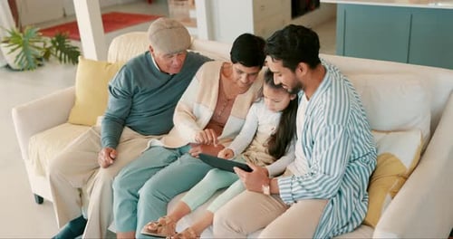 Family Using Tablet Together on Couch