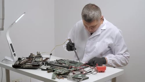 Technician Repairing Computer Circuit Boards
