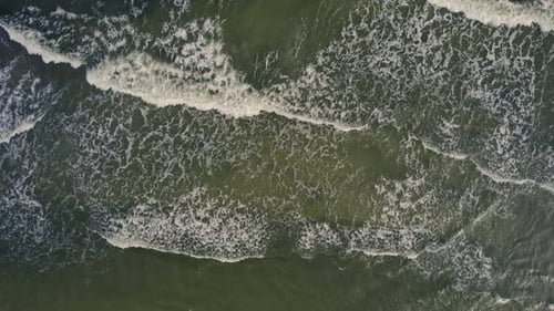 Aerial view of abstract waves and beach along the coastline, Ystad, Sweden.