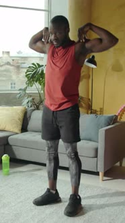 Man in Red Tank Top Exercise at Home