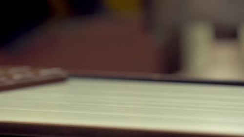 the suction machine places the chocolate bars on the conveyor line