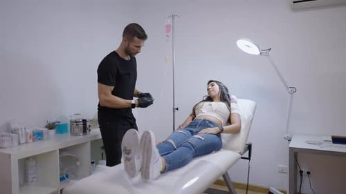 Doctor Putting the IV in the Patients Arm in a Serotherapy Treatment