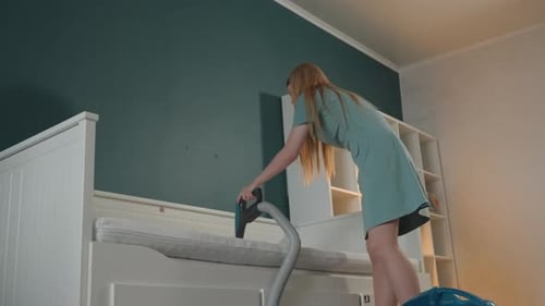 Homeowner Demonstrates Effective Mattress Cleaning Techniques Tealwalled Bedroom with Homeowner