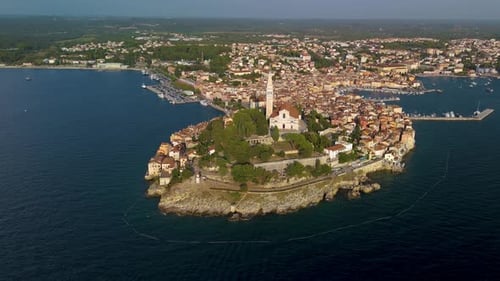 Explore the Stunning Coastal Town of Rovinj with Its Iconic Church and Vibrant Harbor