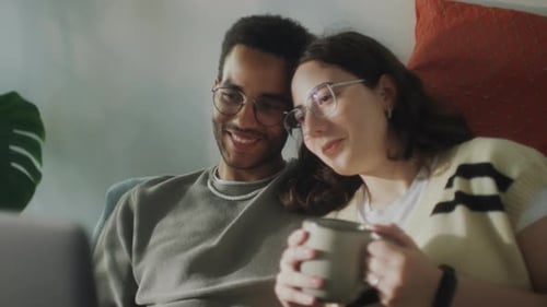 Relaxed Couple Smiling Together at Home