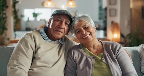 Old couple, face and hug in home to connect, commitment and love for comfort in lounge