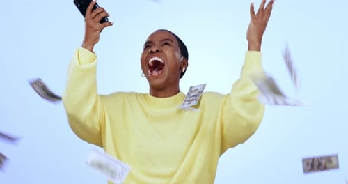 Person with Cellphone Celebrating with Money