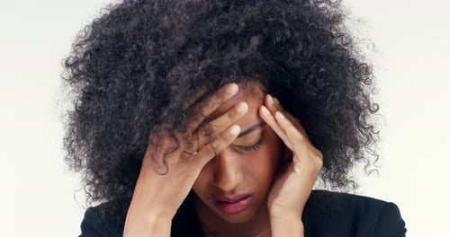 Business woman, stress and headache in studio for mental health, bad results or news of fail