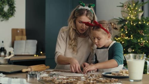 Woman and Child Making Christmas Cookies Together