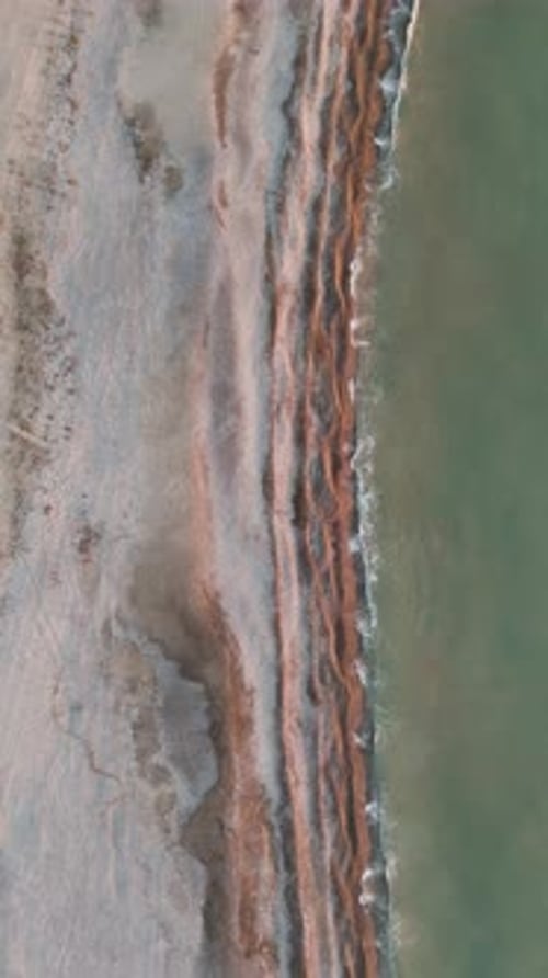 Drone Aerial View Fly By a Beach During Sunrise in Spain