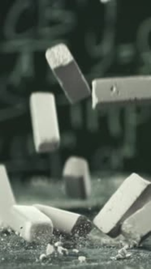 School Chalk Falls on the Desk Filmed on a Highspeed Camera at 1000 Fps