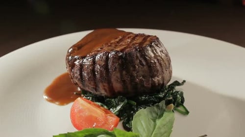 Grilled Steak with Spinach and Tomato Garnish