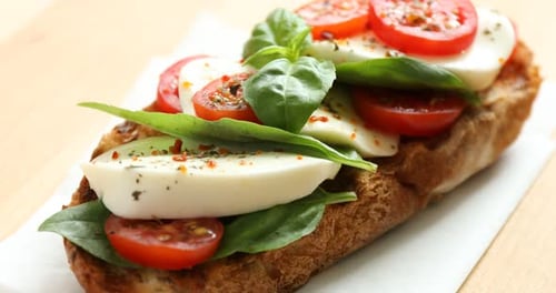 Delicious Caprese Toast Topped with Basil and Tomatoes