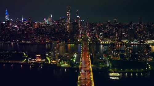 Wonderful Queensboro bridge crossing little island and East River. Amazing cityscape of New York