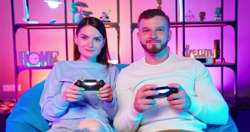 Gamers Play In Neon Room