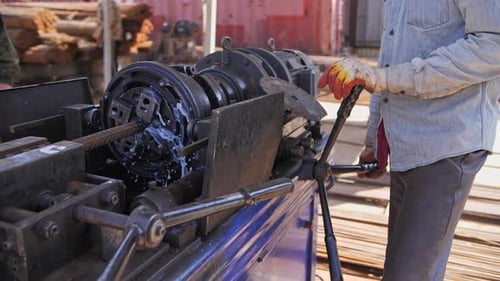 Gloved Operator Cutting Metal With Industrial Tool