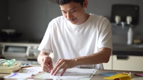 Young Adult Crafting Fashion Design at Home