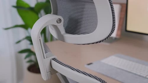 Home Office Set Up With Chair, Table, And Desktop Computer. - close up