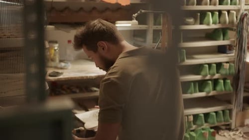 Professional Shoemaker Working on New Footwear in Workshop