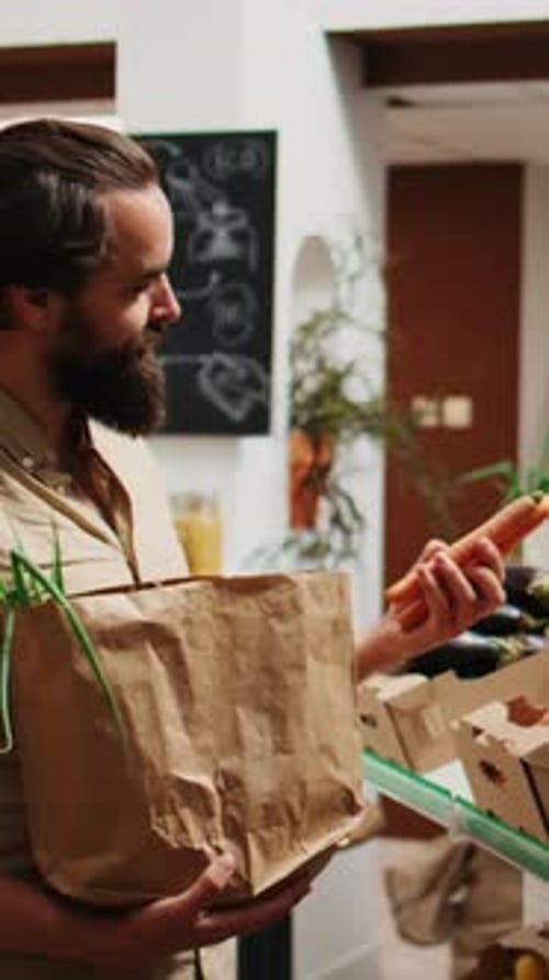 Adult Shopping For Produce at Indoor Market