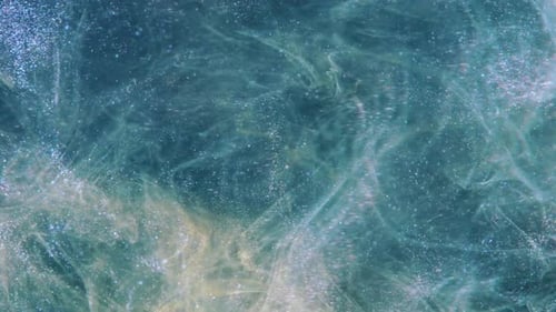 Abstract Blue and Gold Ink Swirls with Glitter