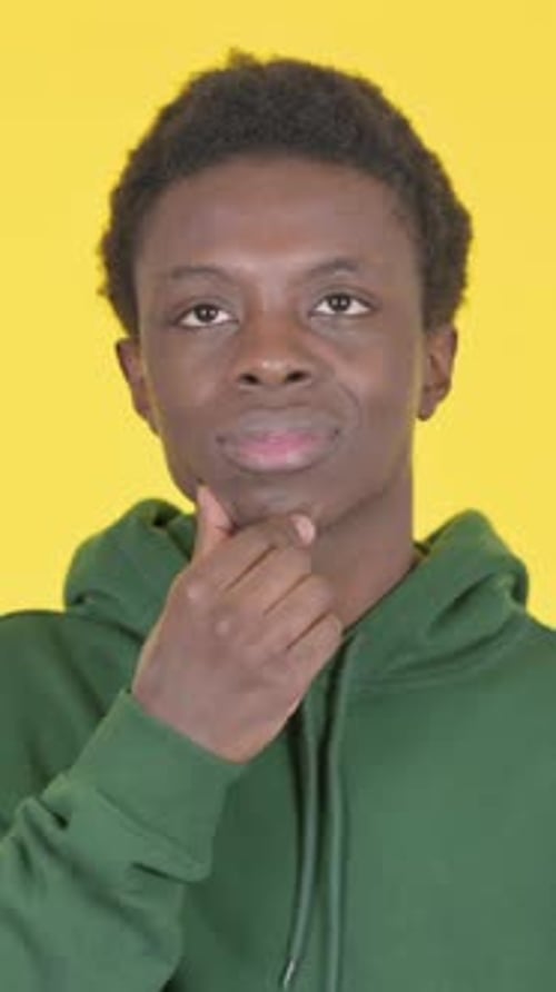 Young Man Thinking and Having an Idea