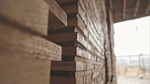 Stack of Pile Wood Bar in Lumber Yard Factory Use for Construction Wood Industry RAW Video Record