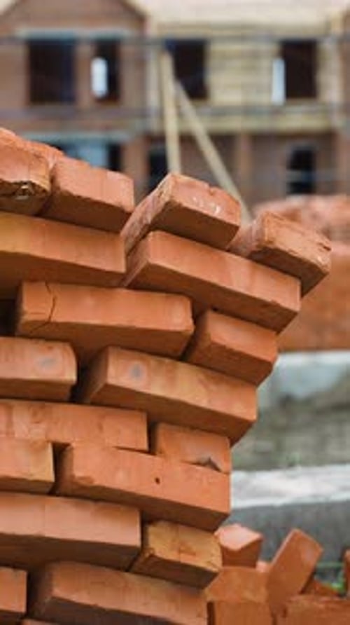 Stacks of Red Bricks at Residential Construction Site