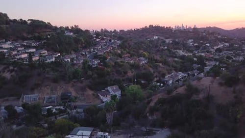 LA: Drone shot of the Downtown Los Angeles Skyline at sunset from the Mt Washington Hills