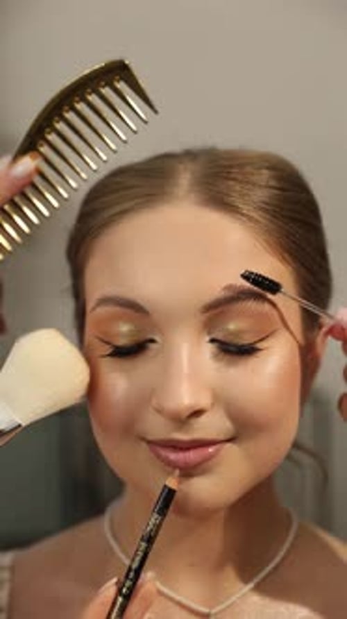 Elegant Woman Receiving Professional Makeup Application