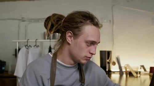 Portrait of Gen Z Businessman with Dreadlocks Working in Workshop