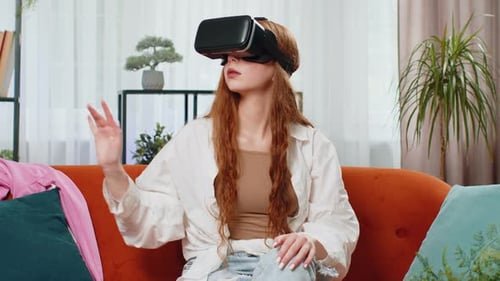 Woman Experiencing Virtual Reality Headset on Couch