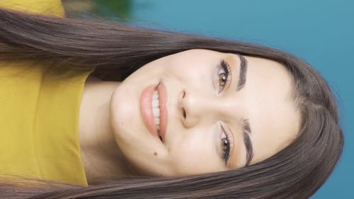 Vertical Video Of Close-up portrait of happy and beautiful woman.
