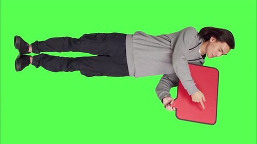 Front View of Young Guy Shows Speech Bubble in Studio