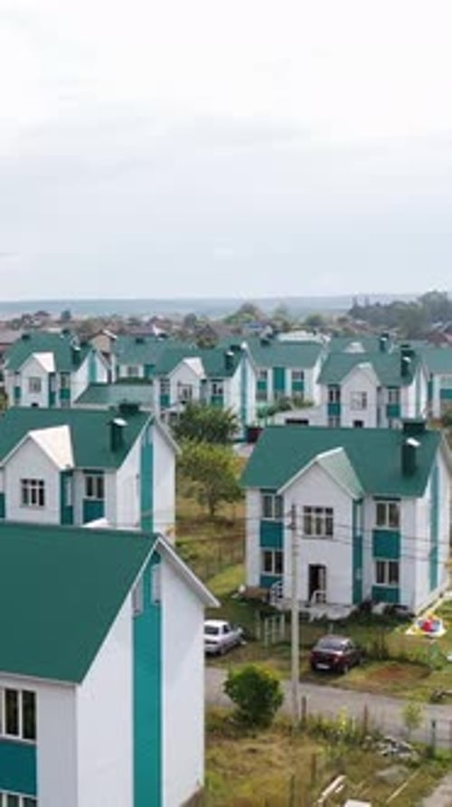 An Aerial View of Several Dozen Identical Houses the Residence of a Community or Commune A Society