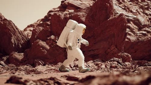 Astronaut Walking On Mars Surface Through Rocky Terrain And Martian Sand 7