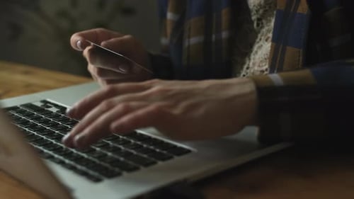 Online Money Transfer Hands Input Bank Payment Card Data Using Laptop