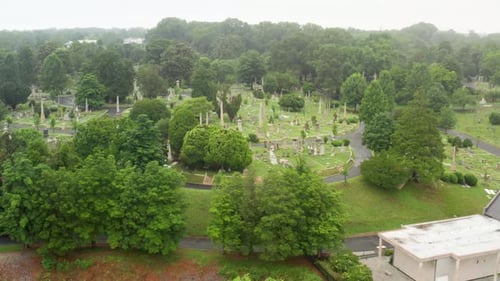 Chapel on hillside of Hollywood Cemetery, Richmond Virginia. Aerial drone shot during summer rainy d