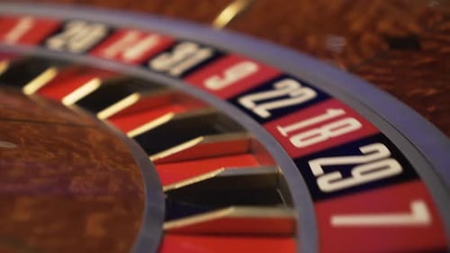 Roulette in casino spinning, extreme closeup view of numbers with no ball