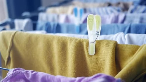 Hanging Laundry on a Sunny Day for Fresh Scents and Cleanliness