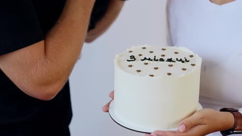 Family Celebrates Baby's Milestone with Sweet Cake