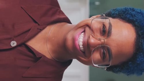 Smiling Woman with Blue Hair in Portrait Close Up
