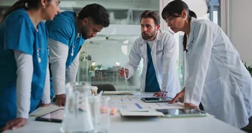 Discussion, documents and doctors in hospital with planning for diagnosis, surgery or treatment