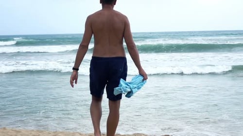 Young, Topless Man in Shorts Walking on Beach, Super 240